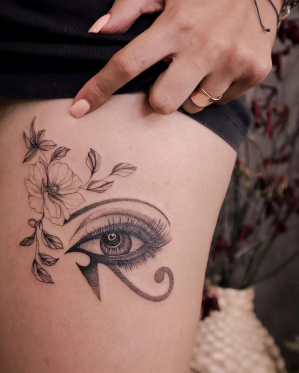 Eye of horus with flower tattoo