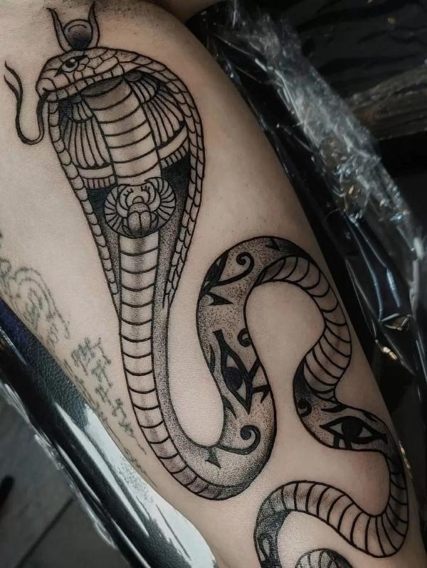 Egyptian Uraues cobra with Scarab beetle Eye of Horus tattoo