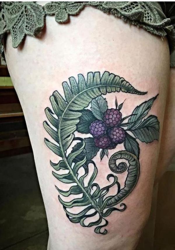 Fern and berry thigh tattoo