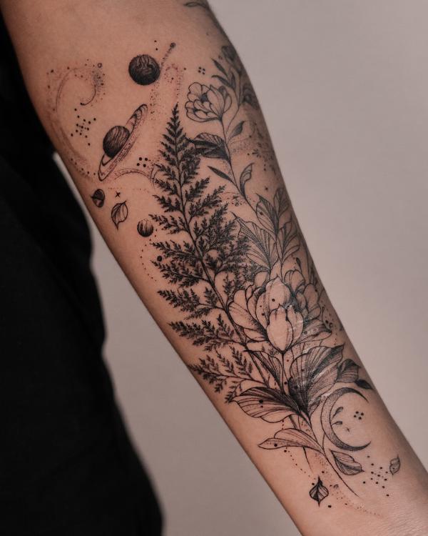 Fern and flowers with planets tattoo