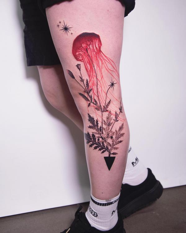 Fern and jellyfish leg tattoo
