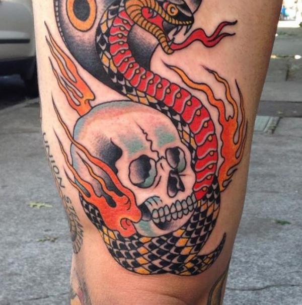 Firing cobra and skull tattoo traditional