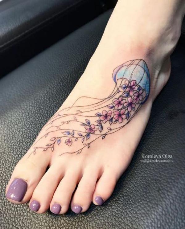 Floral jellyfish foot tattoo