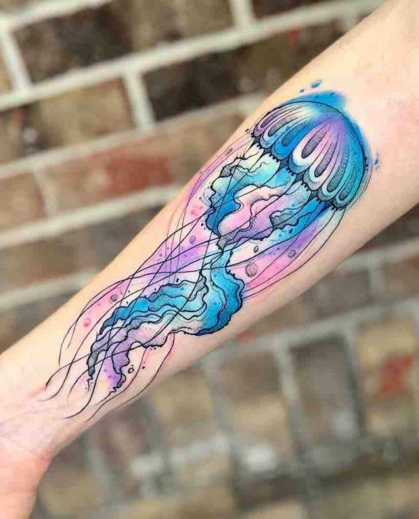 Forearm watercolor jellyfish tattoo