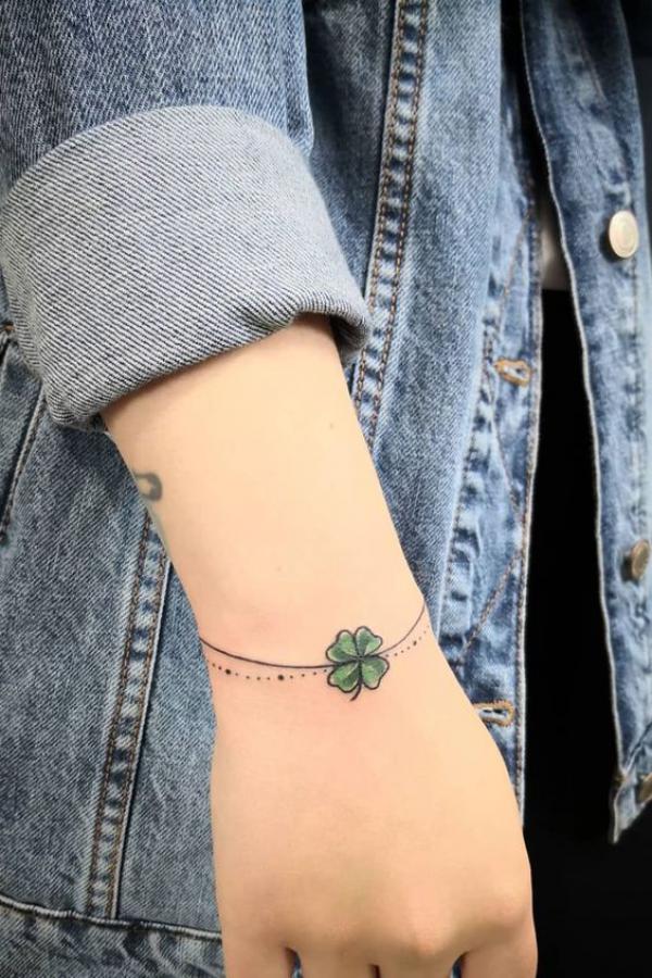 Four leaf clover wrist tattoo