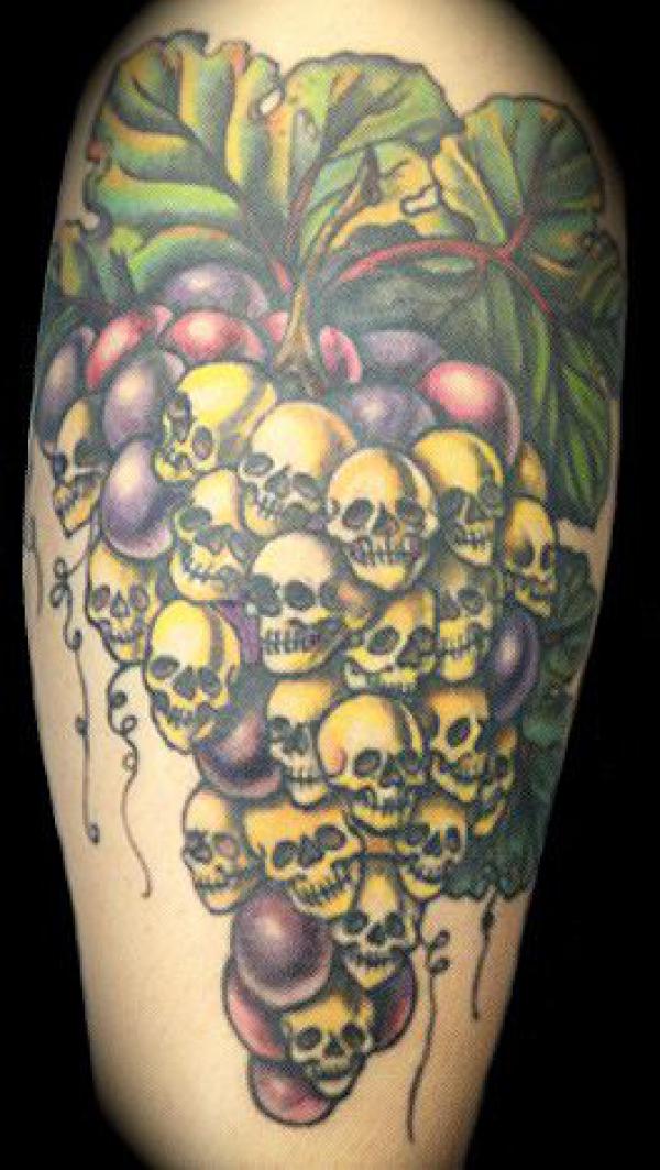 Grapes and skulls tattoo