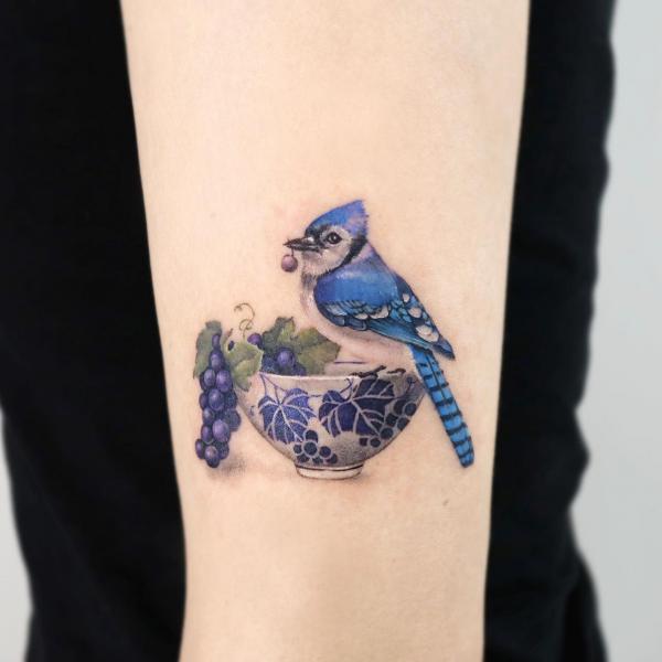 Grapes bowl and blue jay tattoo