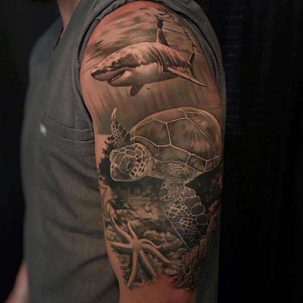 Greyscale shark and turtle tattoo