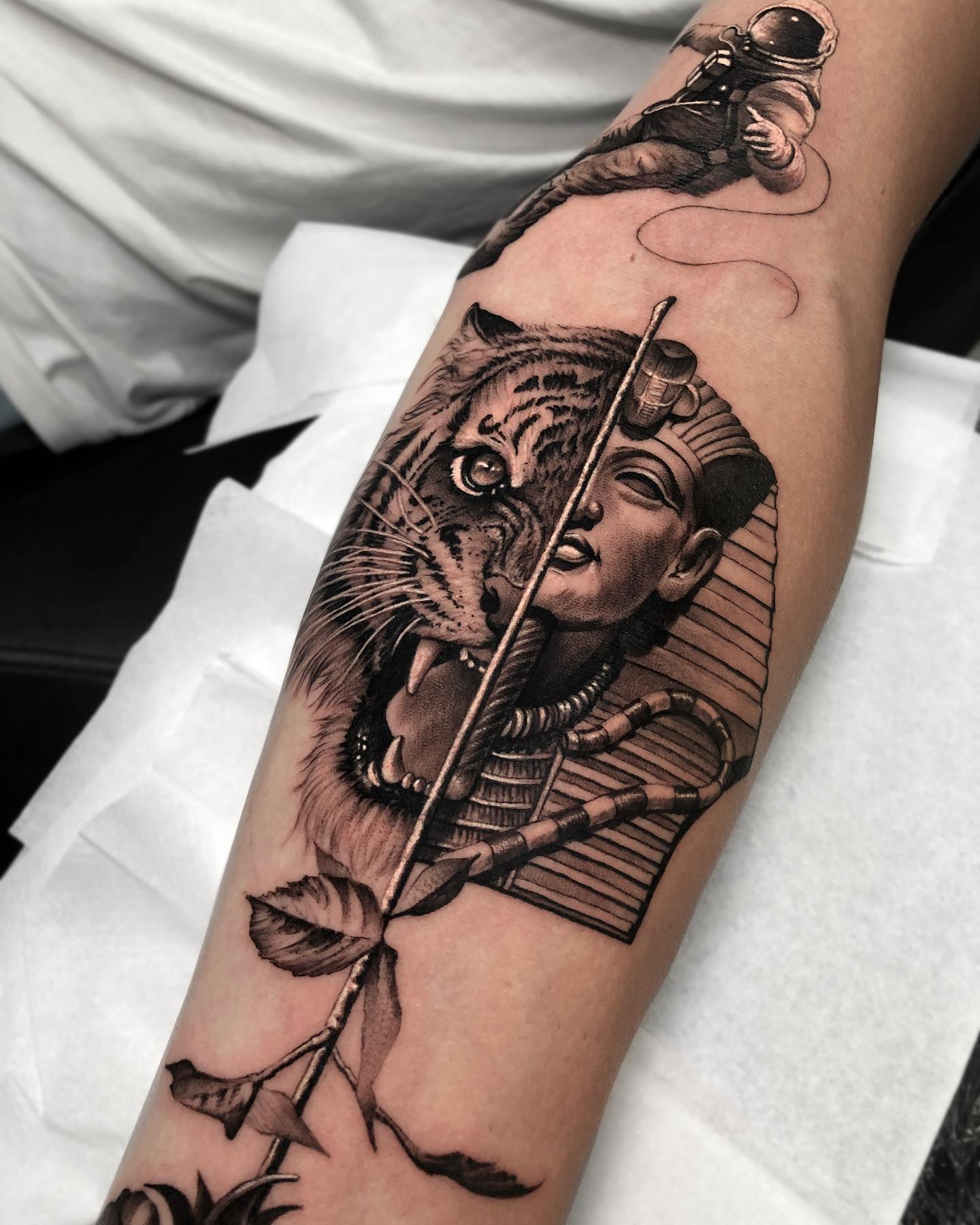 Half tiger half King Tut forearm tattoo