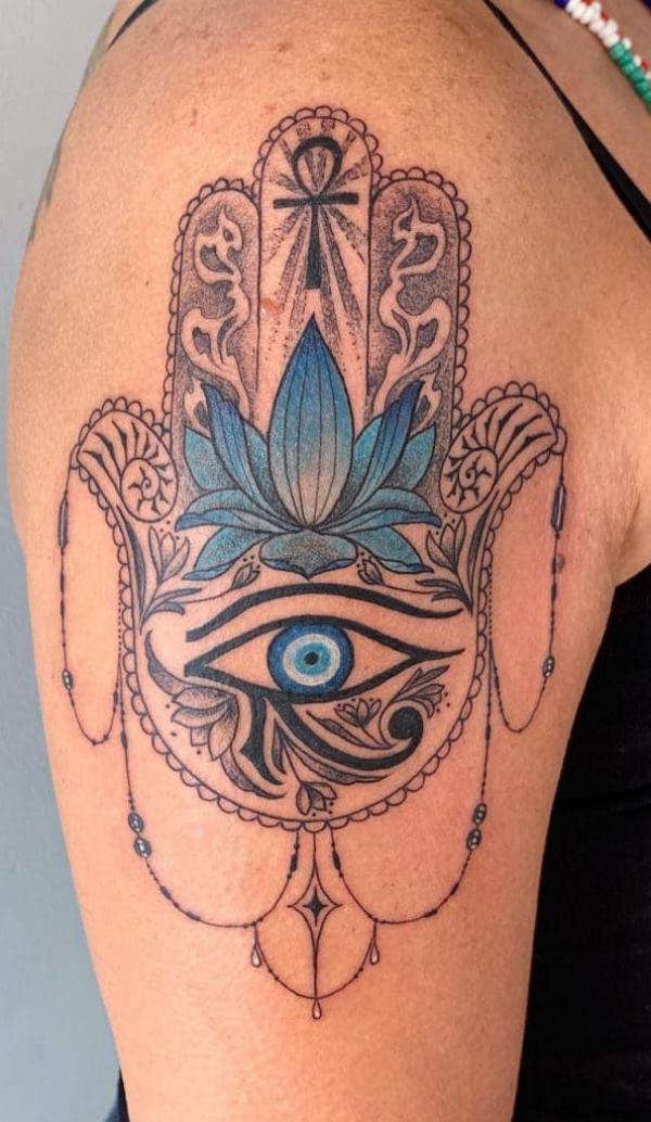 Hamsa with eye of Horus and lotus tattoo