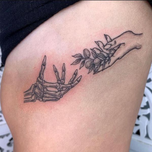 Handing leaves to skeleton hand