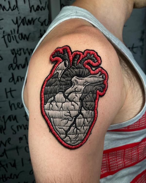 Human heart patch shoulder tattoo