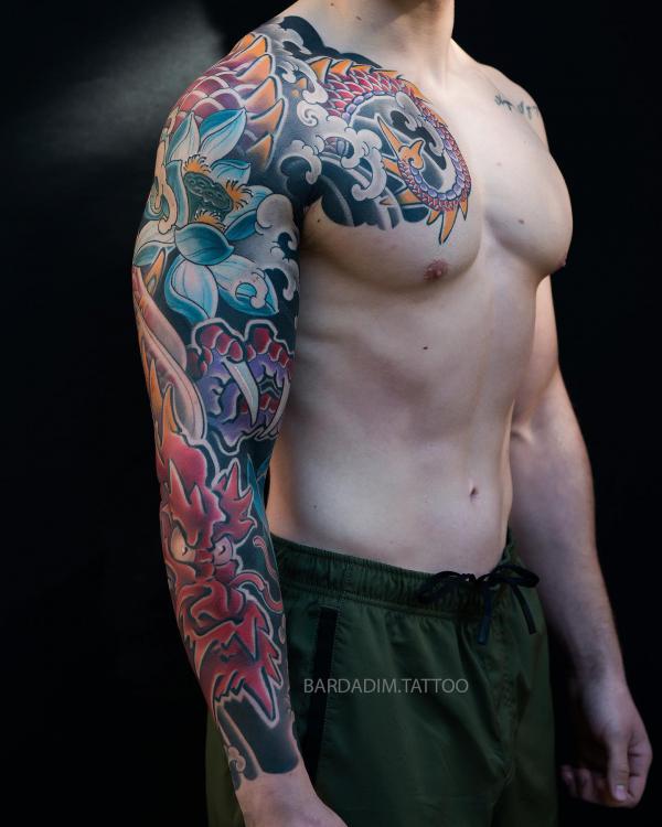 Japanese blue lotus and dragon tattoo sleeve