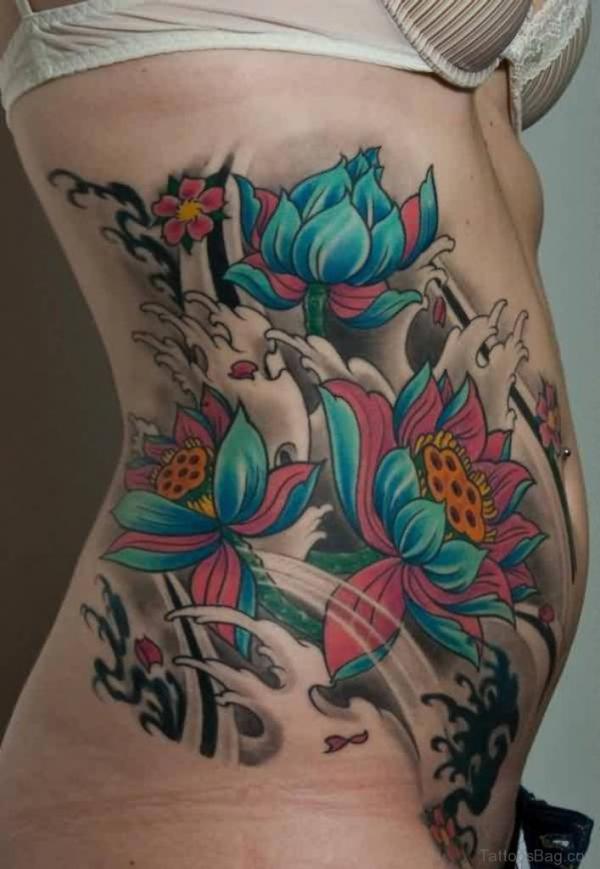 Japanese blue lotus and wave tattoo on side
