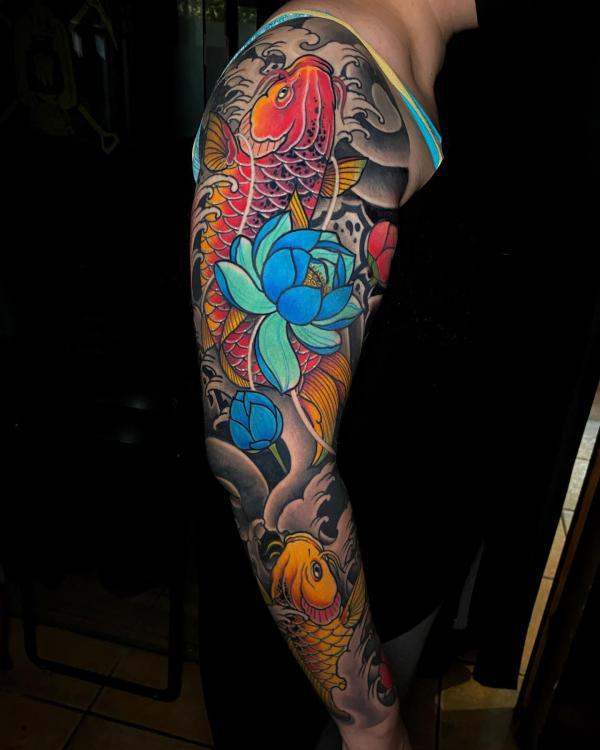 Japanese style blue lotus with koi fish tattoo