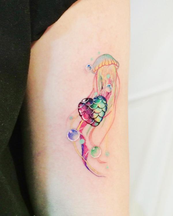 Jellyfish and fish scale heart tattoo