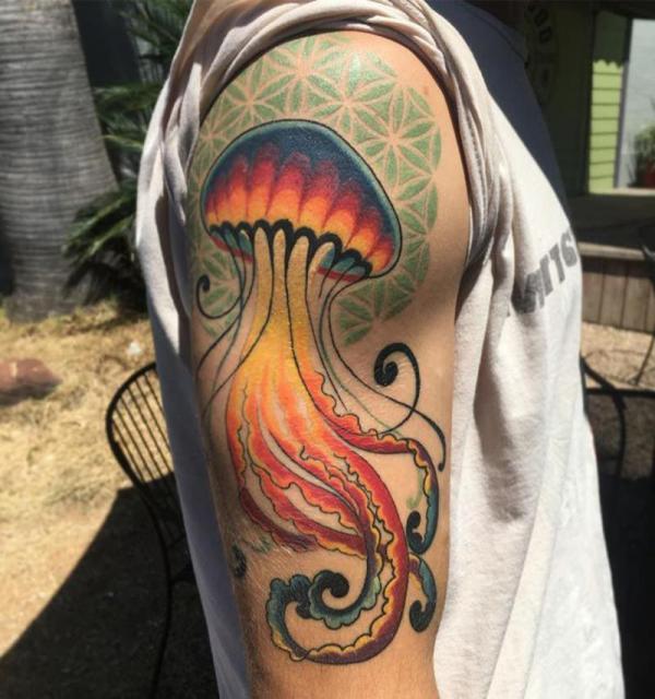 Jellyfish on the backdrop of flower of life tattoo