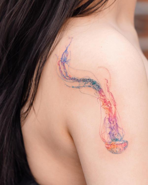 Jellyfish shoulder tattoo upside down