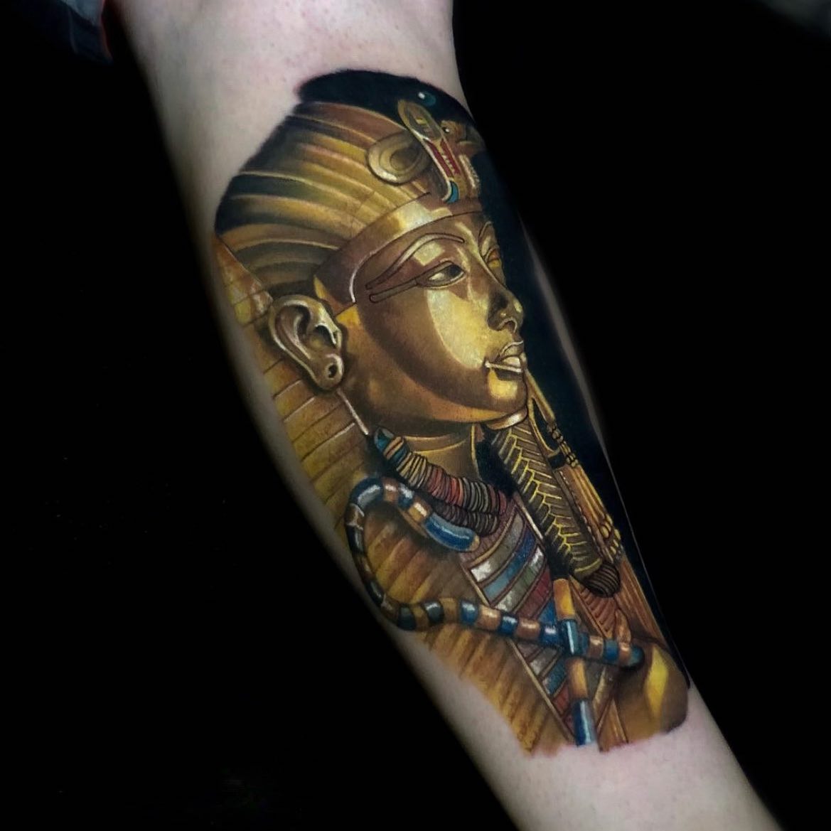 King Tut mask arm tattoo