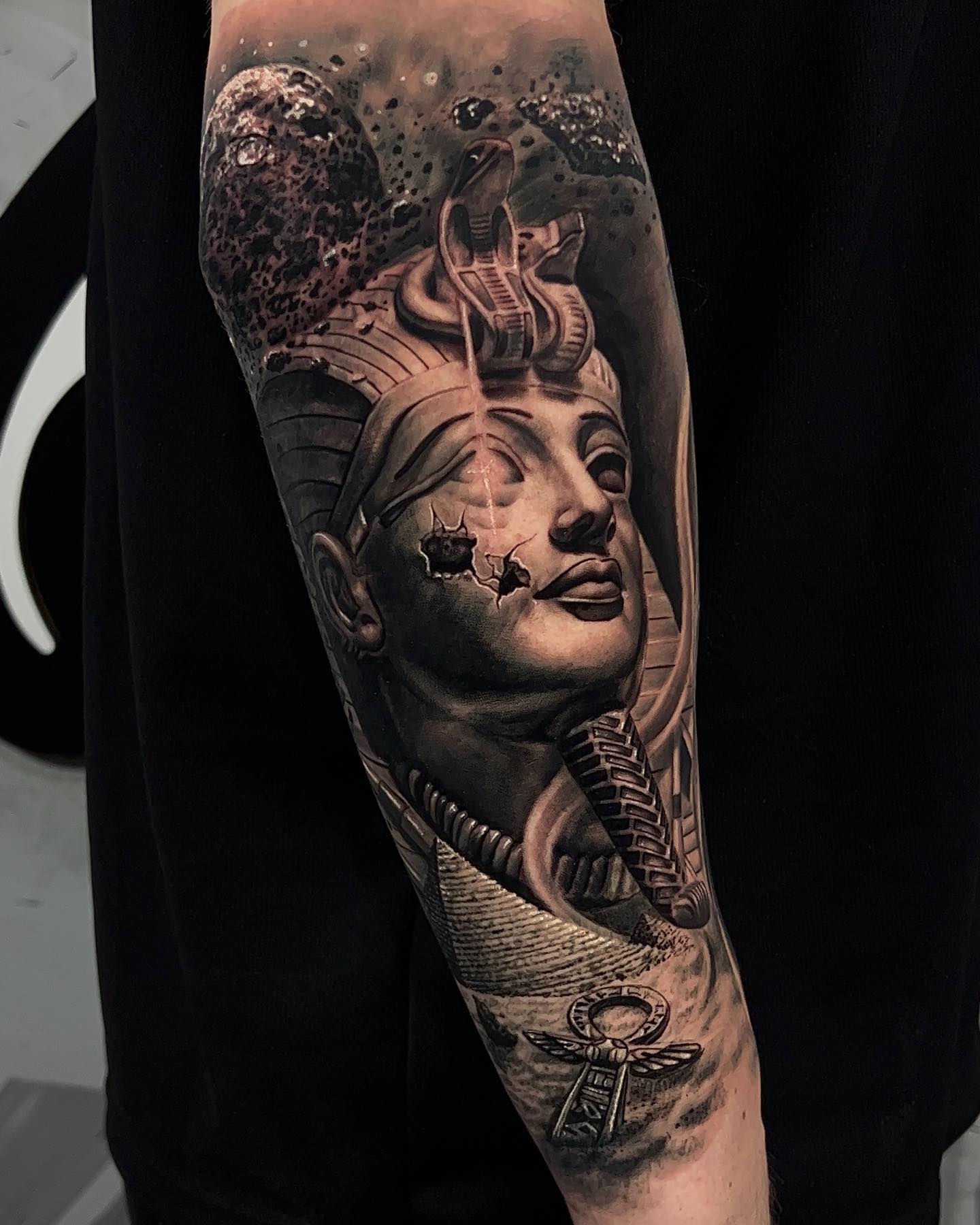 King Tut statue and Ankh tattoo