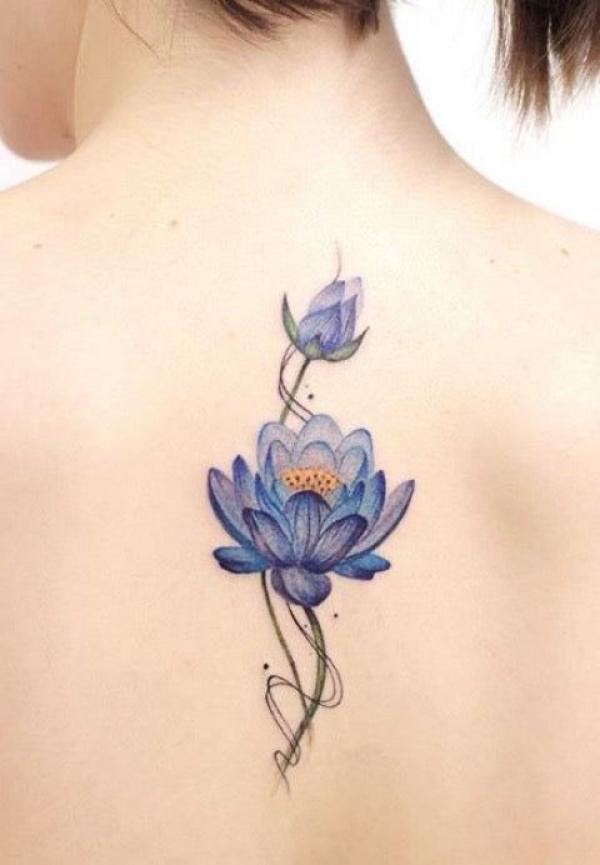 Light blue lotus flower tattoo on back