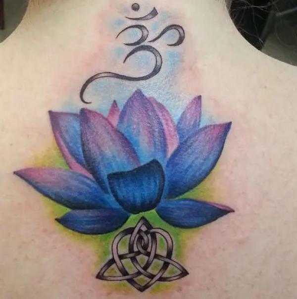 Lotus flower and OM symbol tattoo