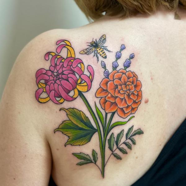 Marigold and chrysanthemum tattoo