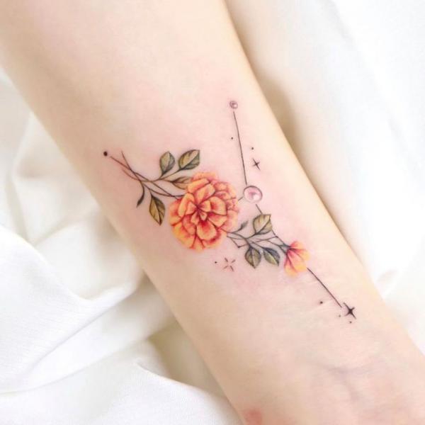 Marigold and stars tattoo