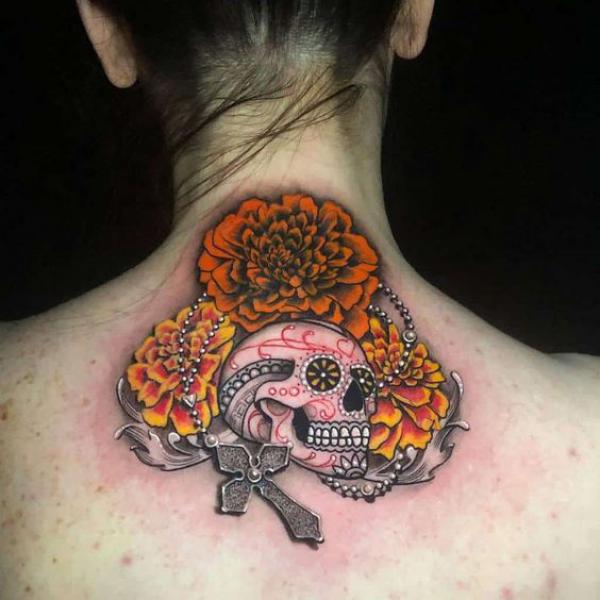 Marigold and sugar skull with cross tattoo