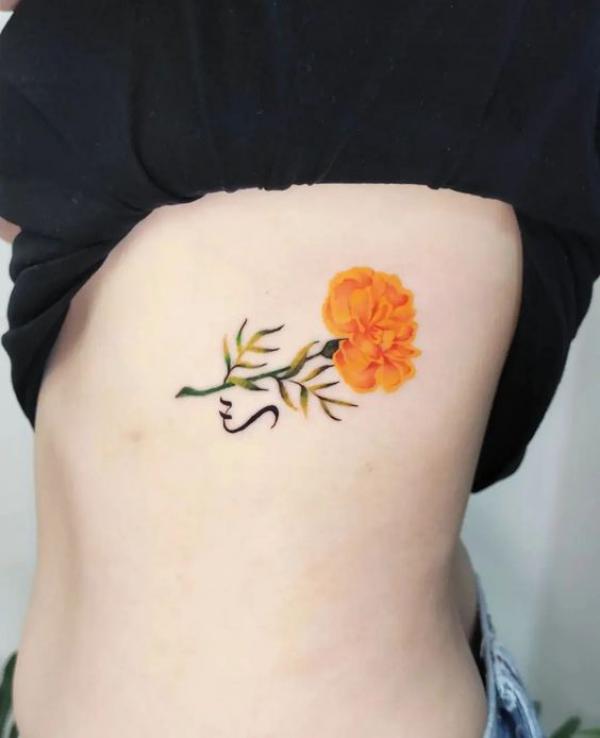 Marigold side tattoo
