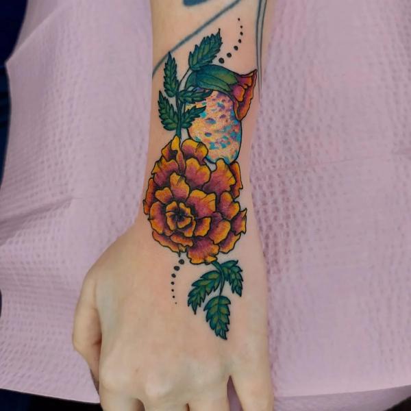 Marigold wrist tattoo