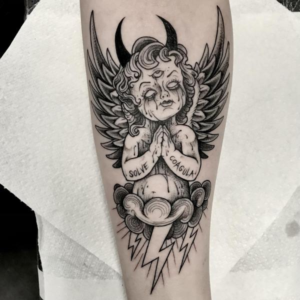 Meditation cherub tattoo with words Solve Coagula
