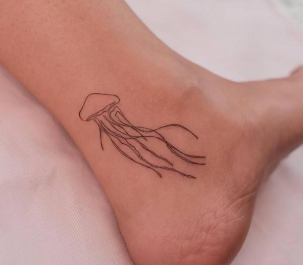 Minimalist Jellyfish tattoo on ankle