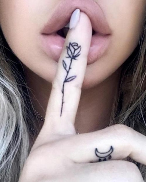 Minimalist rose with thorns finger tattoo