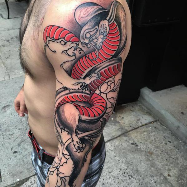 Mongoose fighting a cobra tattoo sleeve