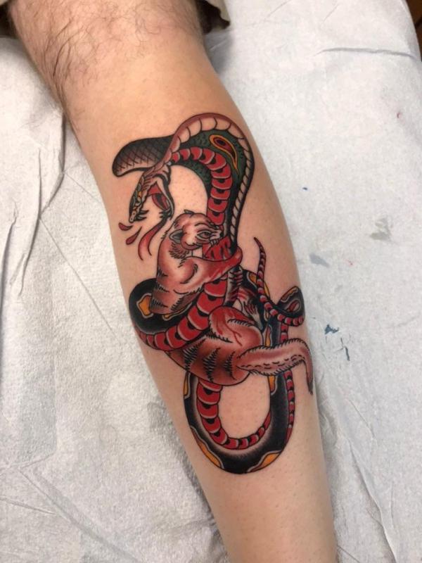 Mongoose fighting a cobra tattoo