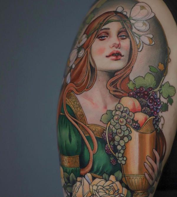 Neo traditional tattoo sleeve of a woman holding a pot of grapes and apple