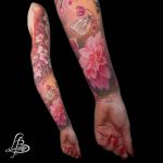 Pink dahlia and white butterfly tattoo