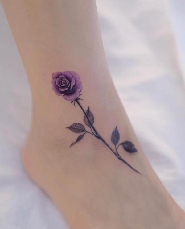 Purple rose with stem ankle tattoo