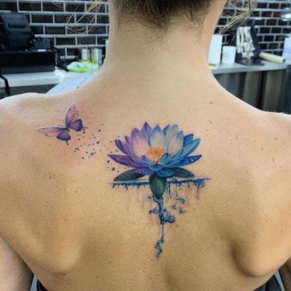 Purple blue lotus and butterfly tattoo
