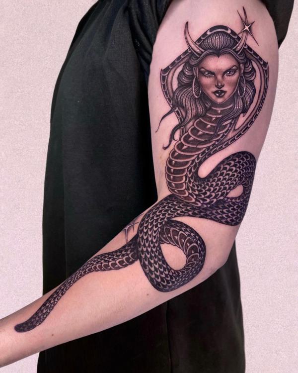Queen cobra arm tattoo