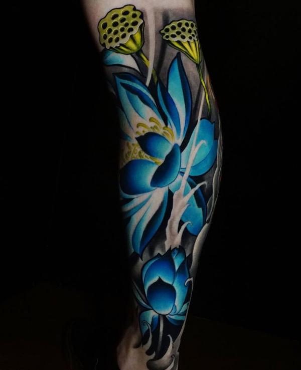 Realistic blue lotus flower leg tattoo
