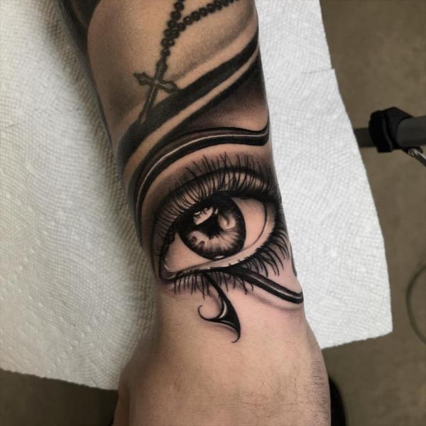 Realistic eye of horus tattoo wrist
