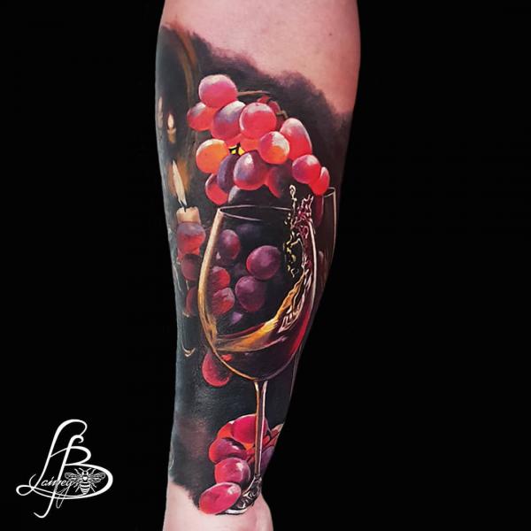 Realistic grape forearm tattoo
