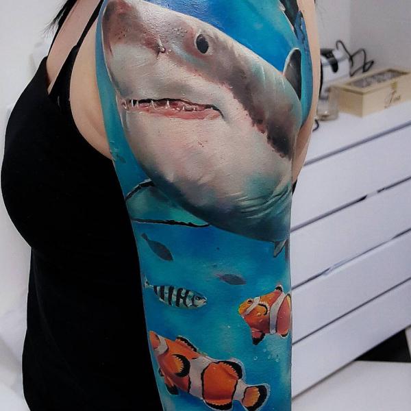 Realistic great white shark with fishes tattoo