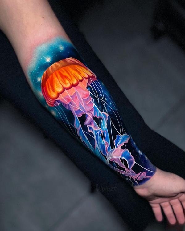 Realistic jellyfish forearm tattoo