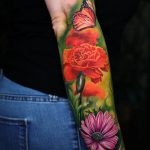 Realistic marigold and daisy with butterfly tattoo forearm