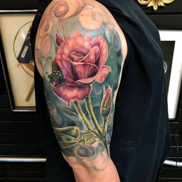 Realistic rose with stem and butterfly