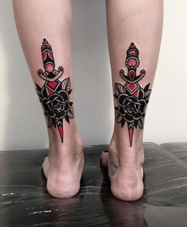Rose and dagger tattoo above heel