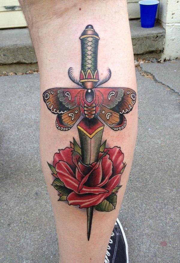 Rose and dagger with moth tattoo